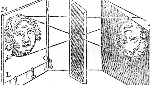 Illustration of the principle of the camera obscura, showing how the image of the lighted face on the left appears inverted on the wall of the darkened chamber on the right. (Image: Getty)